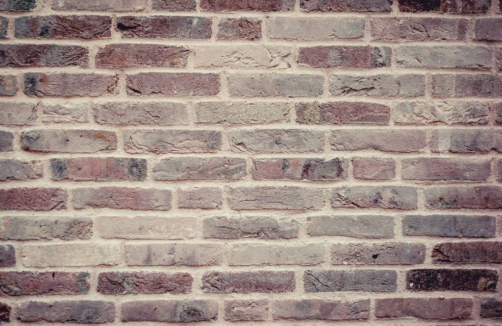 faded red brick wall, background